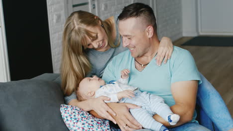 Happy-Family-With-A-Baby-At-Home-Mother-Father-And-Son-Two-Months-Concept---Marital-Happiness-The-Co