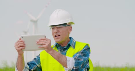 Male-Engineer-Video-Conferencing-Against-Windmills-5