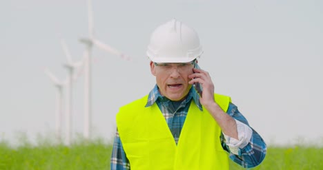 Frustrated-Male-Engineer-Talking-On-Phone-At-Farm-1