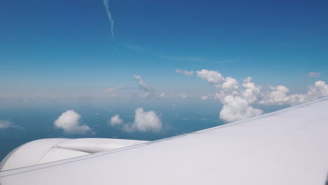 View-From-The-Window-Of-The-Airliner-On-The-Wing-Of-The-Aircraft-With-A-Large-Engine-And-Beautiful-C