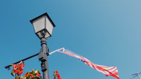 Lamppost-With-Flowers-And-Usa-Flag