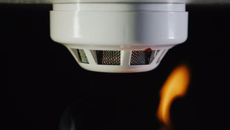 The-Smoke-Detector-Is-Triggered-By-A-Fire-Smoke-And-Flames-Are-Visible-4k-Video