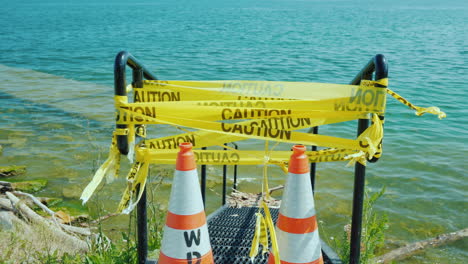 Flooded-Pier-Entrance-With-Warning-Tape