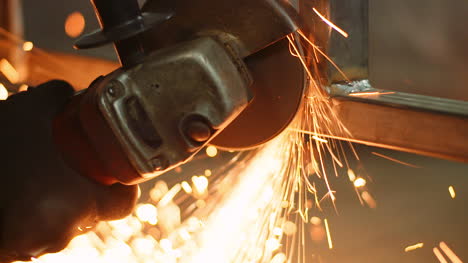 Industry-Worker-Grinding-Metal-With-Angle-Grinder-8