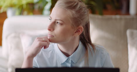 Woman-Working-On-Computer-Thinking-And-Solving-Problem-4