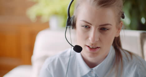 Sales-Representative-In-Headset-Speaking-To-Client-And-Making-Video-Conference-Call-On-Laptop-6