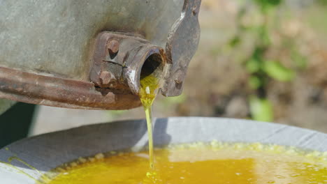 Production-Of-Honey-On-A-Small-Home-Apiary-Honey-Flows-From-A-Tap-Of-A-Honey-Machine-4k-Video