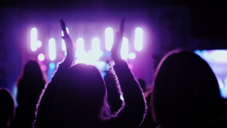Spectators-Clap-Their-Hands-Keep-Their-Hands-Above-Their-Heads-Fans-At-A-Rock-Concert-In-The-Open-Ai