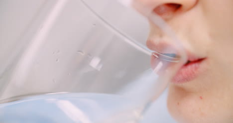 Extreme-Close-Up-Of-Woman-Drinking-Glass-Of-Water