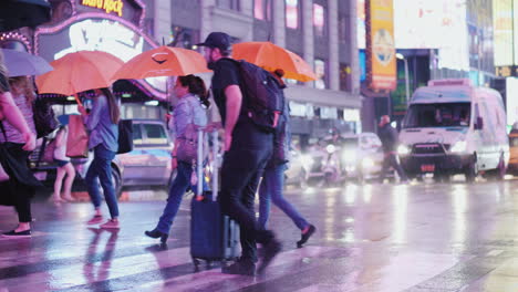 A-Crowd-Of-Pedestrians-With-Umbrellas-In-Their-Hands-In-A-Hurry-To-Cross-The-Street-In-A-Busy-Area-O