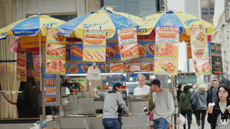 Fast-Food-Kiosks-On-Manhattan-Street-People-Pass-By