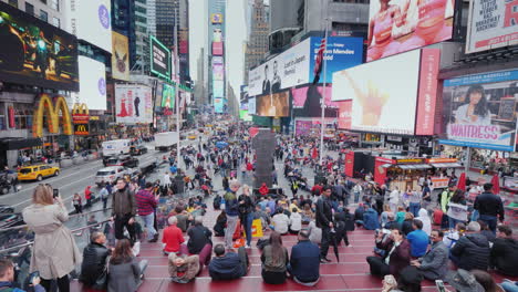 Times-Square-In-New-York-Many-Tourists-Admire-The-Bright-Lights-Of-Advertising-In-The-Heart-Of-The-U