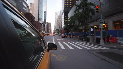Yellow-New-York-Taxi-Rides-Through-The-Streets-Of-Manhattan