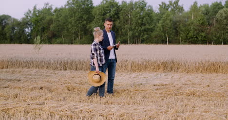 Young-Farmers-Discussing-At-Wheat-Field-9