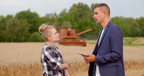 Young-Farmers-Discussing-At-Wheat-Field-25