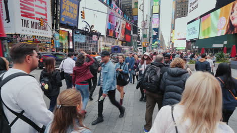 Walk-In-A-Crowd-Of-Tourists-Through-The-Famous-Times-Square-In-New-York