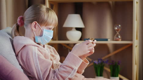 Devuka-In-A-Gauze-Bandage-Plays-On-A-Smartphone-Quarantine-And-Root-Ingesthes-At-Home-Concept