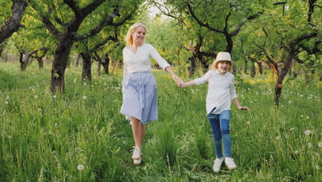 Mom-And-Daughter-Are-Running-Happily-Around-The-Garden-Having-A-Good-Time-Together