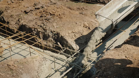 Concrete-Flows-Through-The-Pipe-Into-The-Foundation-Of-The-Basement-Construction-Of-Cottages-Concept