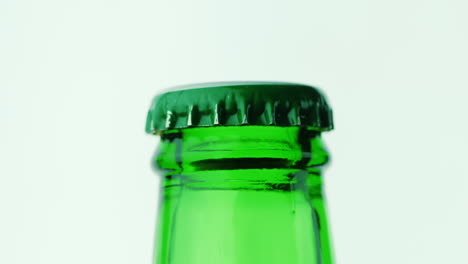 The-Neck-Of-A-Glass-Bottle-With-A-Drink-Is-Covered-With-A-Green-Lid-Hd-Video