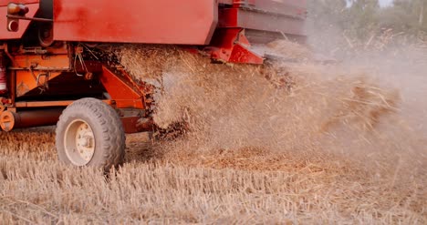 Close-Up-Of-Combine-Harvester-On-Field-At-Farm-11