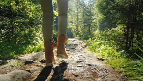 Follow-Shot:-A-Man-In-Trekking-Boots-Walks-Along-A-Slippery-Stony-Path-In-The-Forest-Hiking-And-Acti