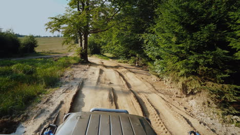 Suv-Rides-On-An-Extremely-Bad-Dirt-Road-A-Top-View-Stabilized-On-3-Axes-Shot