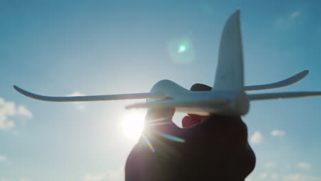 The-Hand-Holds-A-Toy-Like-Plane-Rushing-Toward-The-Sky-To-The-Sky-Dream-And-A-Good-Startup-Concept-4