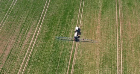 Tractor-Spraying-Pesticides-On-Crops-At-Agriculture-Field-2