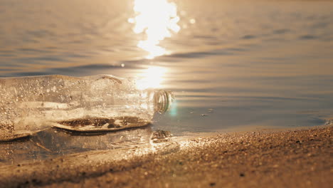 Plastic-Trash-On-The-Seashore-The-Bottle-Lies-On-The-Edge-Of-The-Water