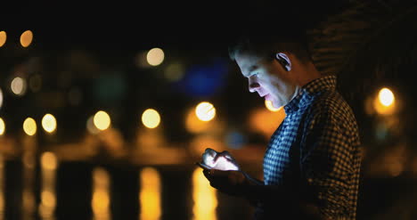 Midnight-Man-Using-Smart-Phone-Typing-Sms