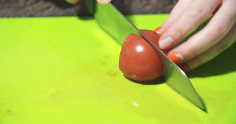 Slicing-Tomato-In-Kitchen-2
