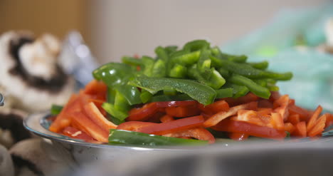 Cut-Green-And-Red-Peppers-In-A-Bowl