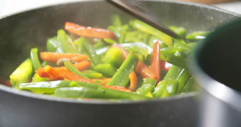 Mixing-Fresh-Vegetables-On-Pan-1