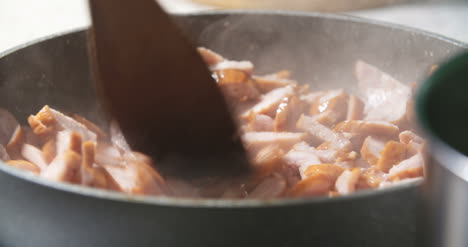 Sausage-Cuts-Frying-On-Pan-5