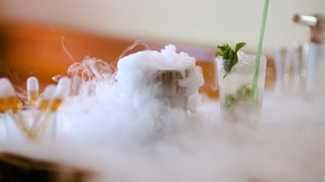Dry-Ice-In-Glass-While-Bartender-Preparing-Drink-1