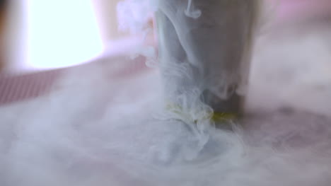 Dry-Ice-In-Glass-While-Bartender-Preparing-Drink-4