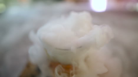 Dry-Ice-In-Glass-While-Bartender-Preparing-Drink-5