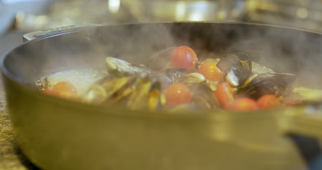 The-Cook-Cooks-Mussels-In-The-Pan-4
