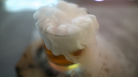 Dry-Ice-In-Glass-While-Bartender-Preparing-Drink-7