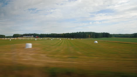 Rural-Landscape-In-Norway---From-The-Window-You-Can-See-Fields-Where-Stacks-Of-Straw-Lie-After-Harve
