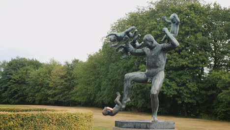 Sculpture-Of-A-Man-Who-Juggles-With-Babies-An-Interesting-Composition-In-The-Sculpture-Park-Of-Gusta