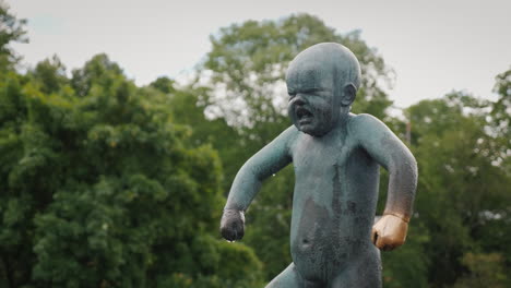 Sculpture-Of-A-Man-Who-Juggles-With-Babies-An-Interesting-Composition-In-The-Sculpture-Park-Of-Gusta