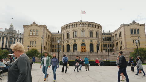 People-Stroll-Around-The-Parliament-Building-In-Oslo
