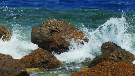 Sea-Waves-Breaking-On-The-Rocks-With-Plenty-Of-Water-Splashing