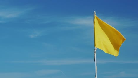 Yellow-Flag-On-A-Background-Of-The-Sky
