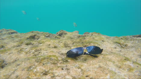 Sunglasses-Under-Water-At-The-Bottom-Of-The-Sea