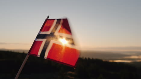 The-Flag-Of-Norway-Flutters-In-The-Wind-The-Sun-Shines-Beautifully-Through-The-Fabric-At-The-Top-Of-