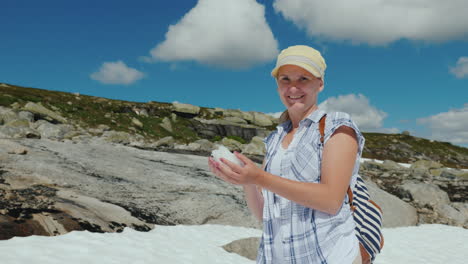 Happy-Woman-Playing-Snowballs-On-A-Glacier-In-Norway-Hot-Summer-But-The-Snow-Has-Not-Melted-Yet---Th