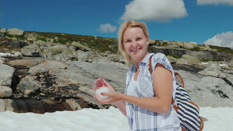 Happy-Woman-Playing-Snowballs-On-A-Glacier-In-Norway-Hot-Summer-But-The-Snow-Has-Not-Melted-Yet---Th